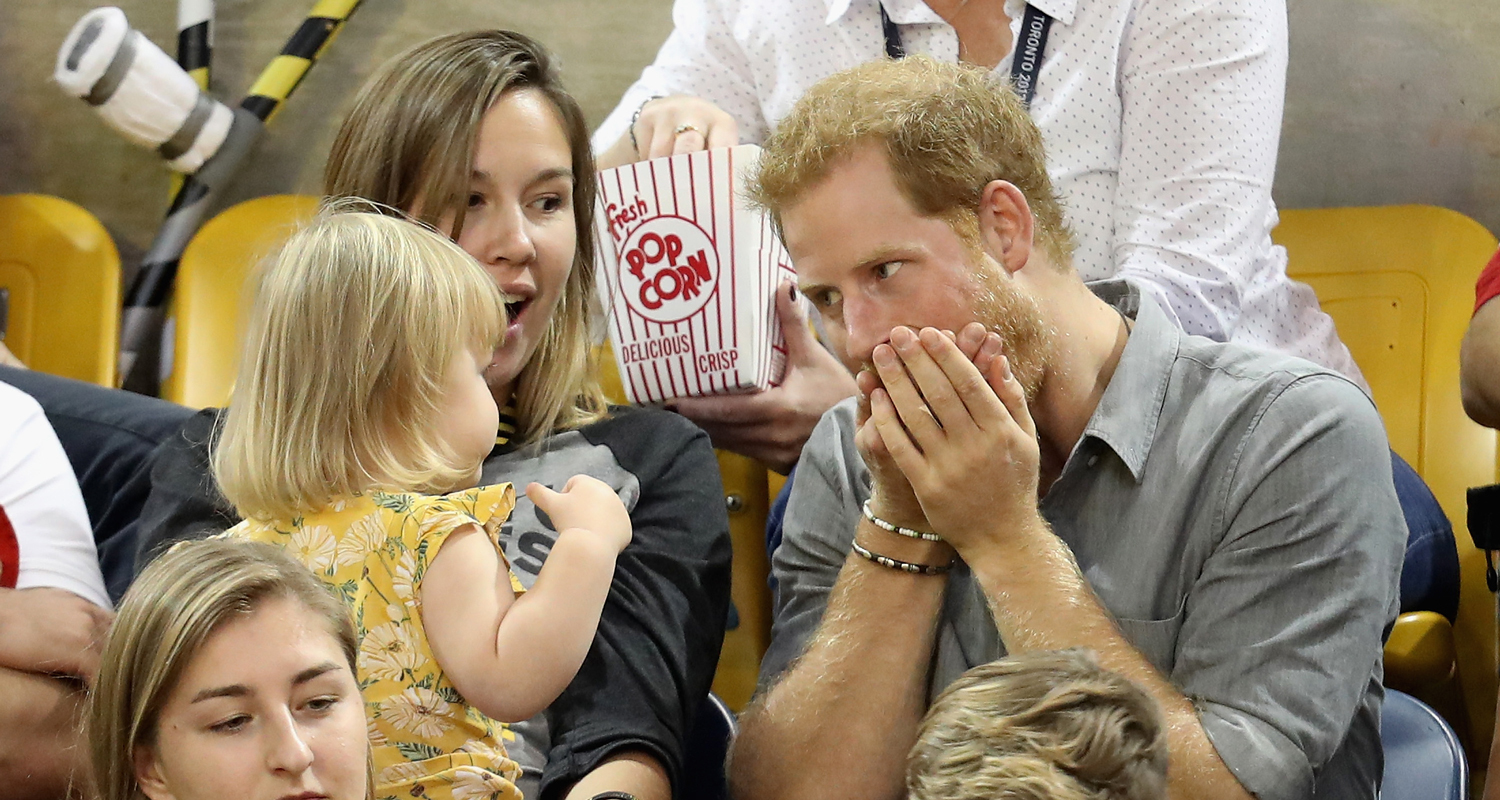 Prince Harry makes funny faces at a baby at the Invictus Games | WHO  Magazine