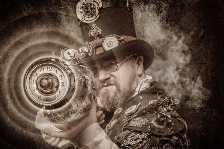 A sepia tone image of a character dressed in steampunk