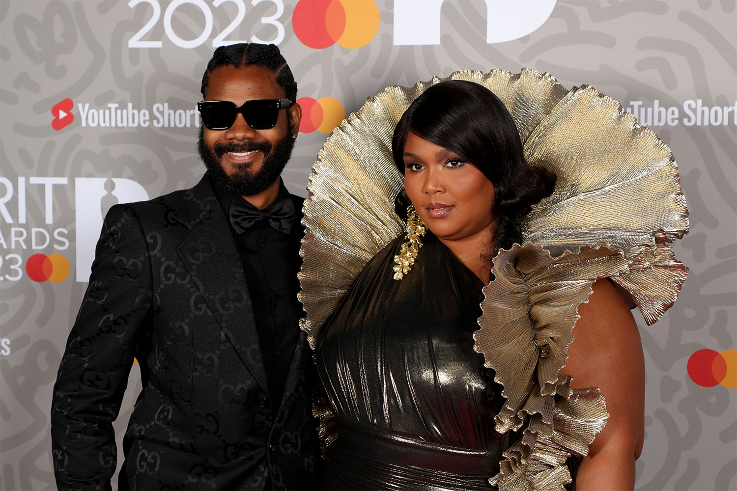 Lizzo-posing-on-the-red-carpet-with-her-partner-Myke-Wright
